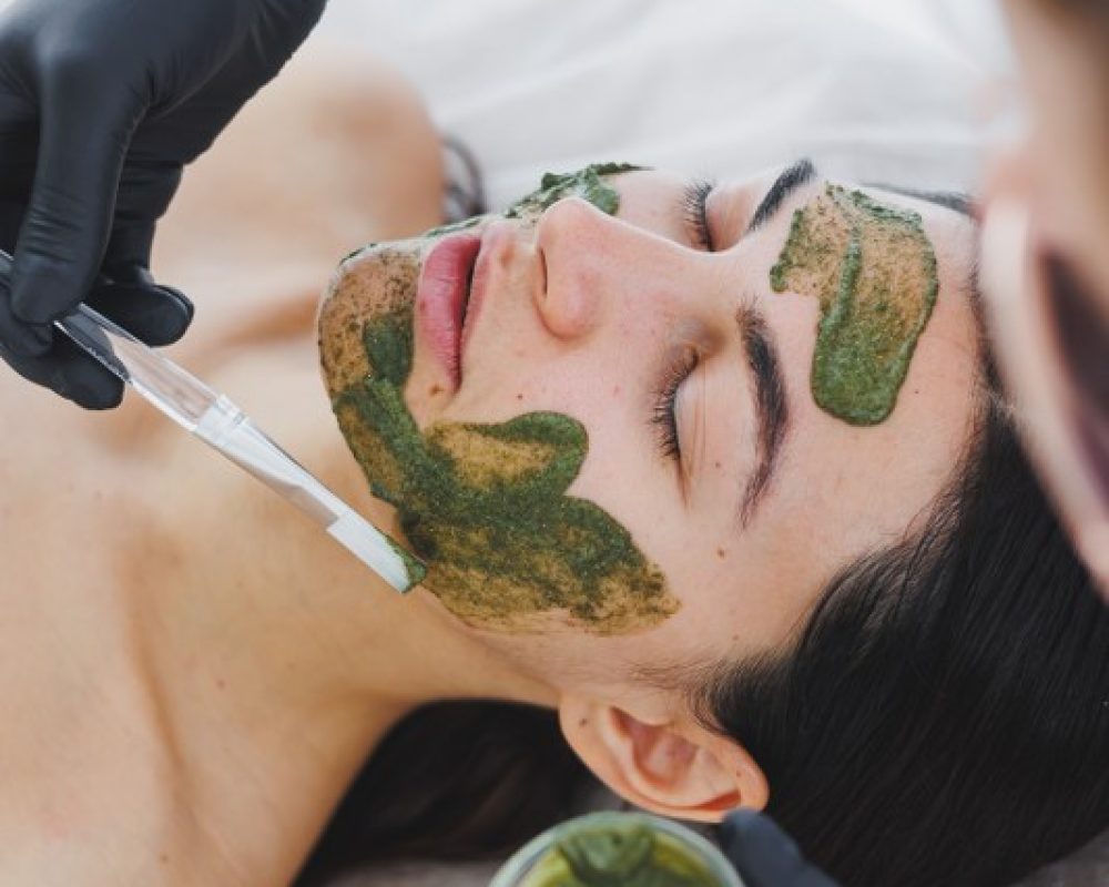 relaxed-woman-receiving-facial-mask-treatment-at-s-2026-09-22-07-22-31-utc