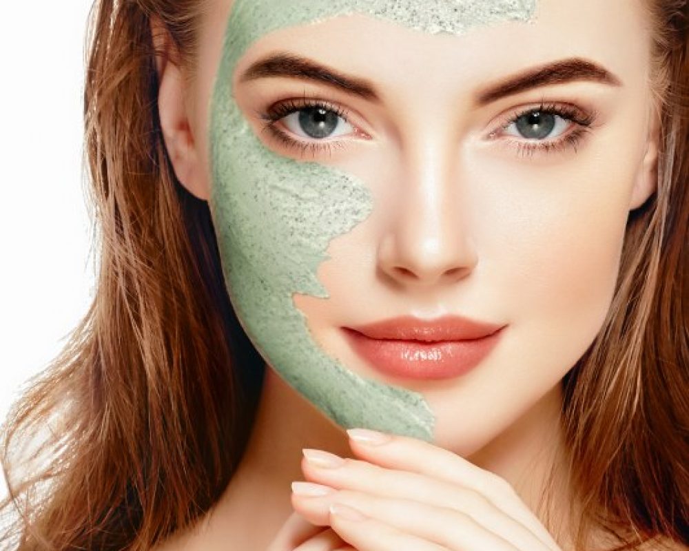 Woman spa mask half-face beauty concept healthy portrait.